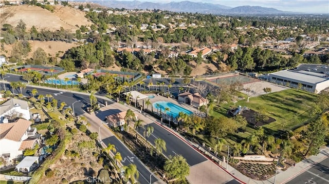 19752 Sierra Meadows Ln, Porter Ranch, CA 91326 - aerial overview of property's location featuring a mountainous background and nearby suburban area