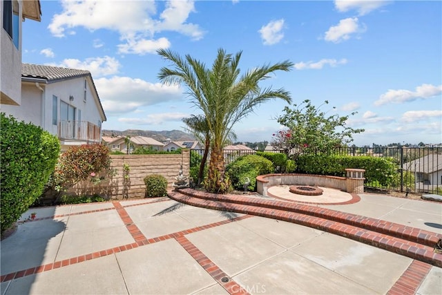 19752 Sierra Meadows Ln, Porter Ranch, CA 91326 - view of patio featuring an outdoor fire pit and a residential view