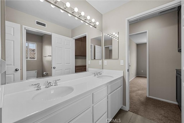 19752 Sierra Meadows Ln, Porter Ranch, CA 91326 - full bathroom featuring double vanity and tile patterned floors