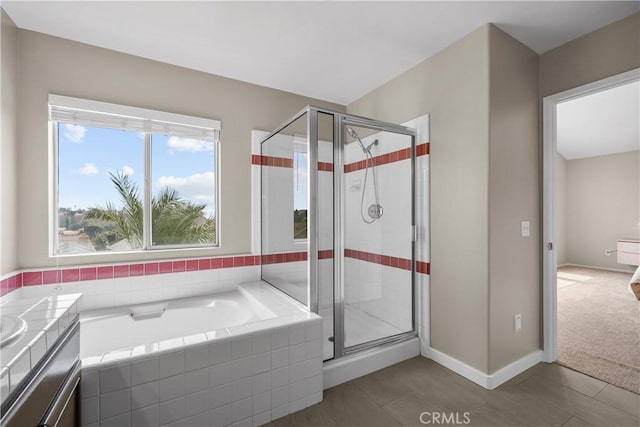 19752 Sierra Meadows Ln, Porter Ranch, CA 91326 - bathroom with a shower stall, a garden tub, vanity, and tile patterned flooring