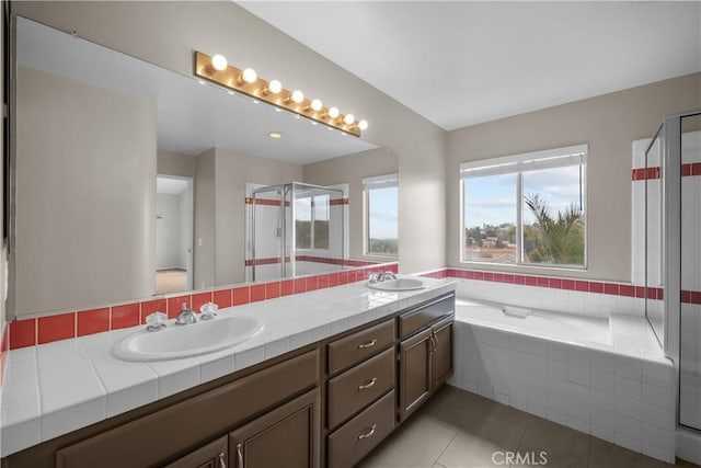 19752 Sierra Meadows Ln, Porter Ranch, CA 91326 - bathroom featuring double vanity, a bath, tile patterned flooring, and a shower stall