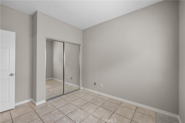 19752 Sierra Meadows Ln, Porter Ranch, CA 91326 - unfurnished bedroom with a closet and light tile patterned floors