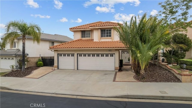 19752 Sierra Meadows Ln, Porter Ranch, CA 91326 - mediterranean / spanish-style home with stucco siding, driveway, a tile roof, and a garage