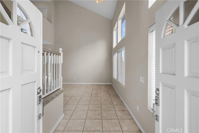 19752 Sierra Meadows Ln, Porter Ranch, CA 91326 - entryway with high vaulted ceiling and light tile patterned flooring