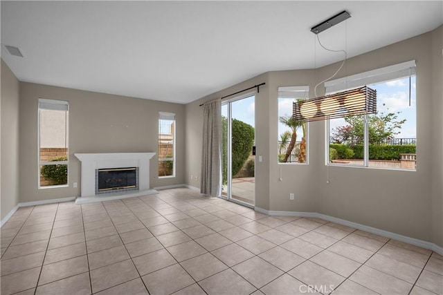 19752 Sierra Meadows Ln, Porter Ranch, CA 91326 - unfurnished living room with light tile patterned floors and a glass covered fireplace