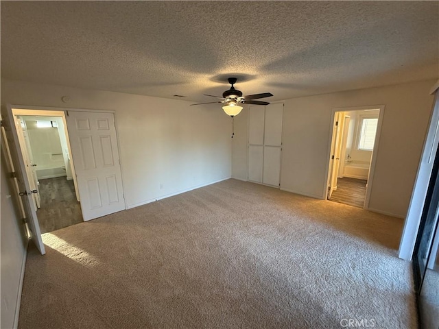 15332 Tuscola Rd, Apple Valley, CA 92307 - unfurnished bedroom with carpet flooring, a textured ceiling, ensuite bathroom, a ceiling fan, and baseboards
