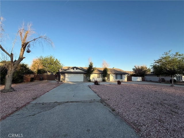 15332 Tuscola Rd, Apple Valley, CA 92307 - ranch-style home featuring driveway, a garage, and stucco siding