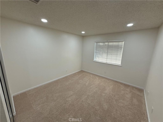 15332 Tuscola Rd, Apple Valley, CA 92307 - spare room with carpet floors, recessed lighting, a textured ceiling, and baseboards