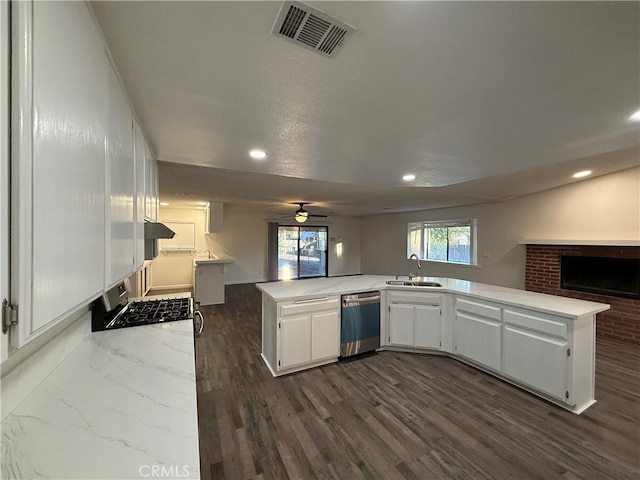 15332 Tuscola Rd, Apple Valley, CA 92307 - kitchen featuring appliances with stainless steel finishes, a sink, open floor plan, recessed lighting, and white cabinetry