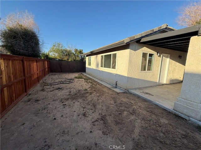 15332 Tuscola Rd, Apple Valley, CA 92307 - view of property exterior with stucco siding and a fenced backyard