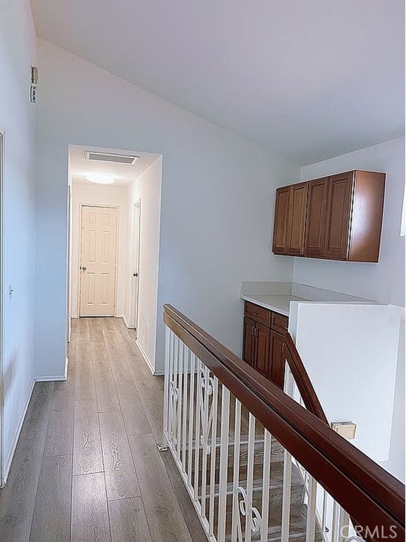 410 Russell Ave Unit C, Monterey Park, CA 91755 - hallway featuring an upstairs landing, light wood-style floors, and baseboards