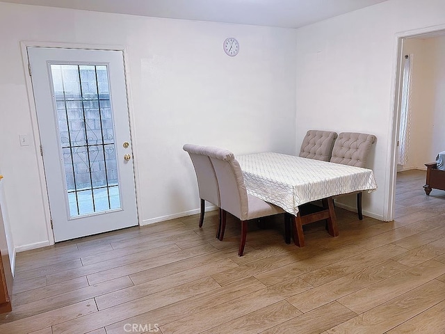 410 Russell Ave Unit C, Monterey Park, CA 91755 - dining area featuring light wood-style flooring and baseboards