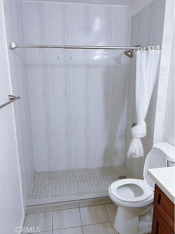 410 Russell Ave Unit C, Monterey Park, CA 91755 - full bathroom with tile patterned flooring, toilet, a stall shower, and vanity