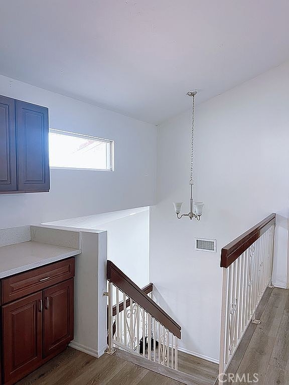 410 Russell Ave Unit C, Monterey Park, CA 91755 - stairs with wood finished floors and a chandelier