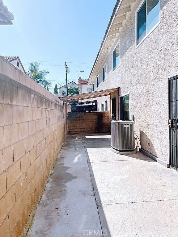 410 Russell Ave Unit C, Monterey Park, CA 91755 - fenced backyard featuring cooling unit and a patio