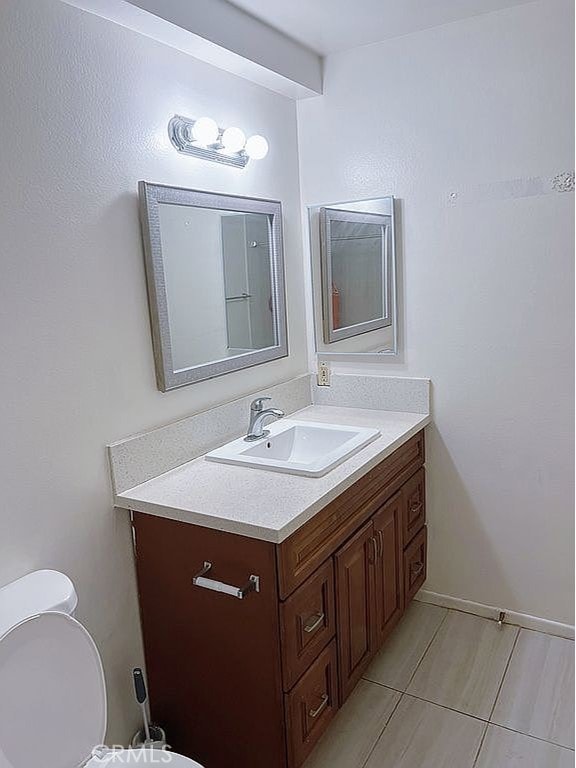 410 Russell Ave Unit C, Monterey Park, CA 91755 - half bathroom with vanity, toilet, and tile patterned flooring