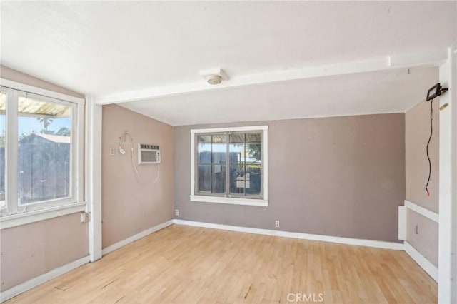 1385 Turquoise Ave, Mentone, CA 92359 - unfurnished room with wood finished floors, baseboards, and healthy amount of natural light