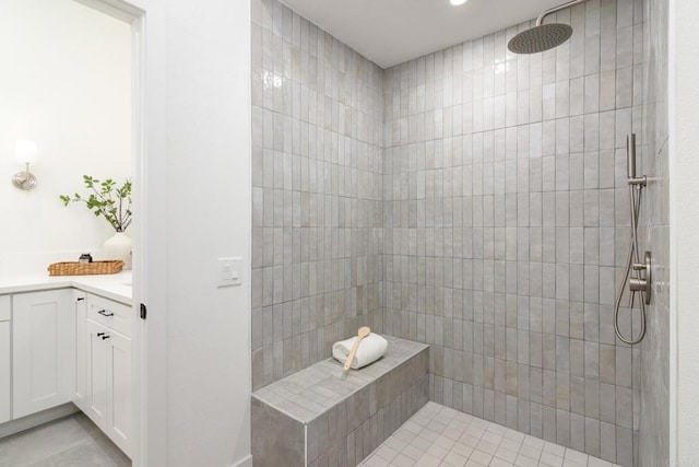 4161 Rhodes Way, Oceanside, CA 92056 - bathroom featuring tiled shower, vanity, and tile patterned floors