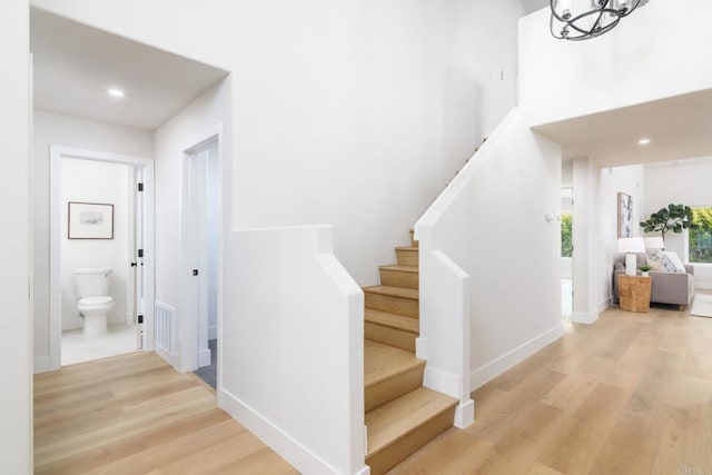 4161 Rhodes Way, Oceanside, CA 92056 - staircase with wood finished floors, recessed lighting, baseboards, a chandelier, and a high ceiling