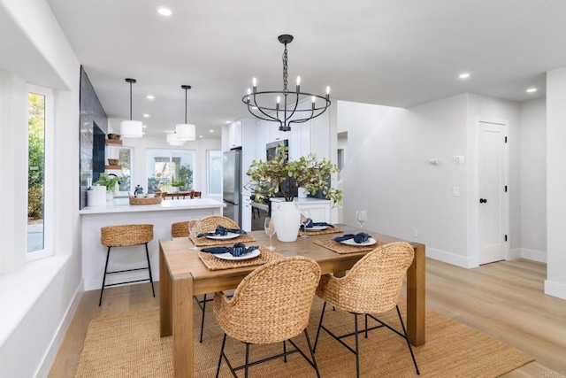 4161 Rhodes Way, Oceanside, CA 92056 - dining area with recessed lighting, a chandelier, light wood-type flooring, and baseboards