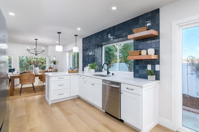 4161 Rhodes Way, Oceanside, CA 92056 - kitchen featuring dishwasher, a sink, open shelves, a peninsula, and light wood-type flooring