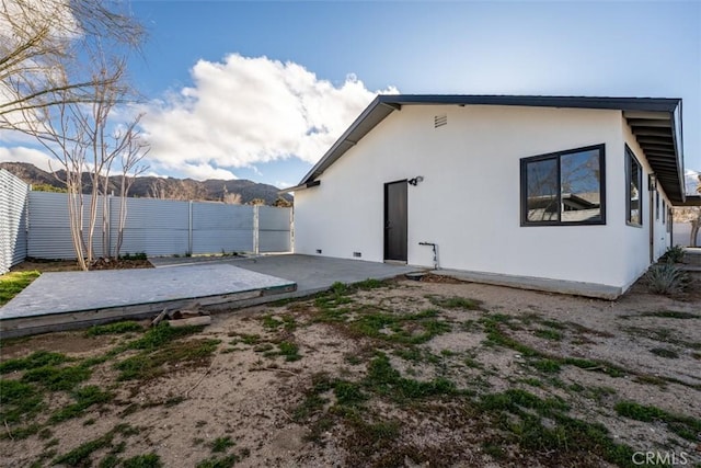 60468 Latham Trl, Joshua Tree, CA 92252 - rear view of house with stucco siding and a patio