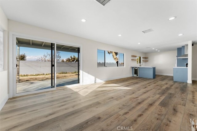 60468 Latham Trl, Joshua Tree, CA 92252 - unfurnished living room with light wood-style floors, recessed lighting, baseboards, and a sink