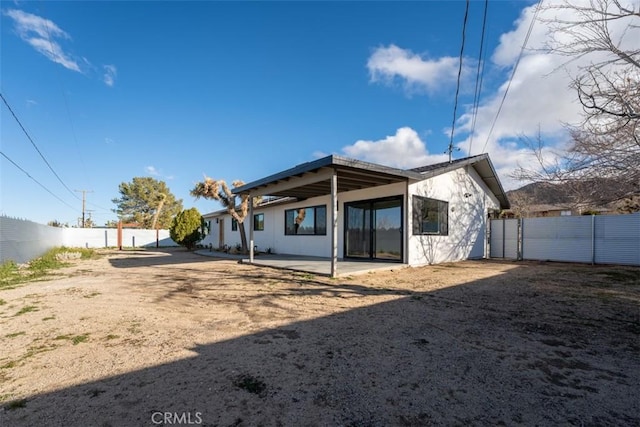 60468 Latham Trl, Joshua Tree, CA 92252 - rear view of property featuring a fenced backyard and a patio