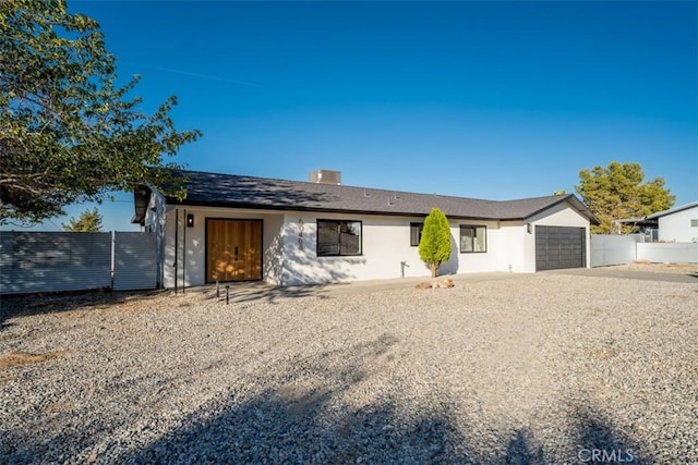 60468 Latham Trl, Joshua Tree, CA 92252 - ranch-style home with an attached garage, driveway, and stucco siding