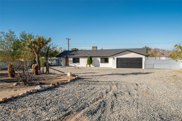 60468 Latham Trl, Joshua Tree, CA 92252 - ranch-style house with a garage, concrete driveway, and stucco siding