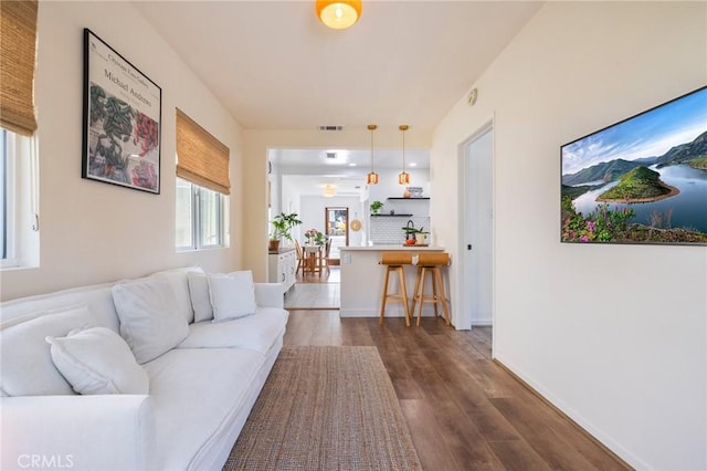 4142 Mercury Ave, Los Angeles, CA 90031 - living room with dark wood-style flooring and baseboards