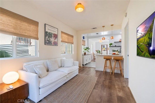 4142 Mercury Ave, Los Angeles, CA 90031 - living room featuring dark wood finished floors and baseboards