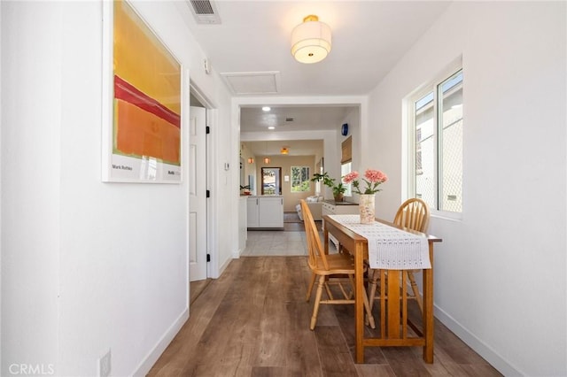 4142 Mercury Ave, Los Angeles, CA 90031 - dining area with attic access, wood finished floors, and baseboards