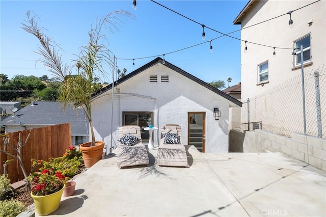 4142 Mercury Ave, Los Angeles, CA 90031 - rear view of house with a patio, stucco siding, and an outdoor hangout area