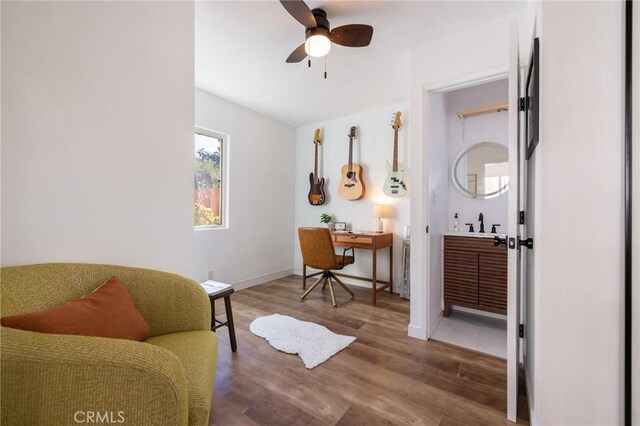 4142 Mercury Ave, Los Angeles, CA 90031 - living area with ceiling fan, wood finished floors, a desk, and baseboards