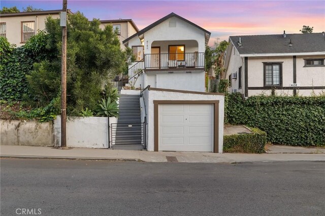 4142 Mercury Ave, Los Angeles, CA 90031 - view of front of home with stairs, stucco siding, and a garage