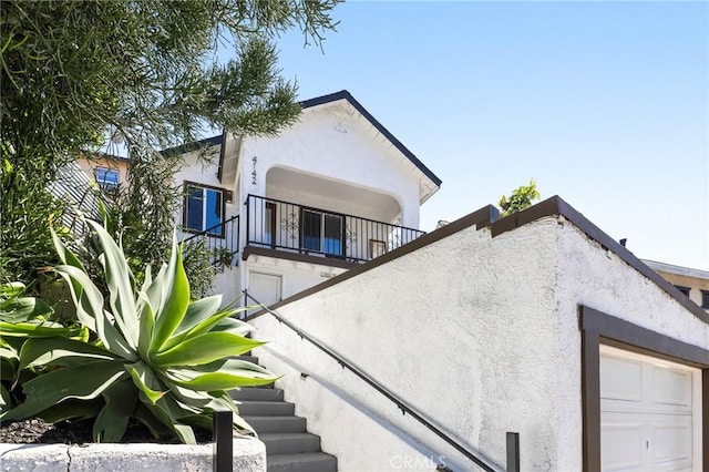4142 Mercury Ave, Los Angeles, CA 90031 - back of house with stucco siding, a balcony, and stairs