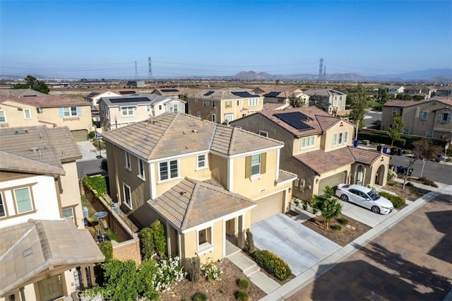 3235 E Olympic Dr, Ontario, CA 91762 - aerial perspective of suburban area with a mountainous background