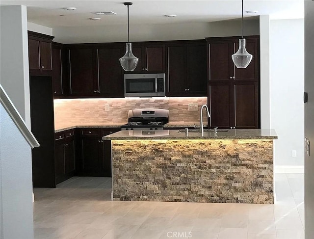 3235 E Olympic Dr, Ontario, CA 91762 - kitchen with appliances with stainless steel finishes, a sink, stone countertops, decorative backsplash, and recessed lighting