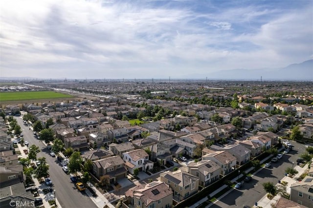 3235 E Olympic Dr, Ontario, CA 91762 - aerial view of property and surrounding area with nearby suburban area and a mountain backdrop