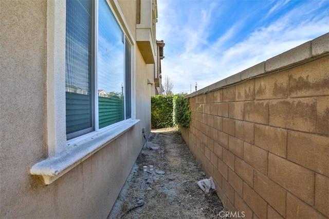 3235 E Olympic Dr, Ontario, CA 91762 - view of side of property with stucco siding