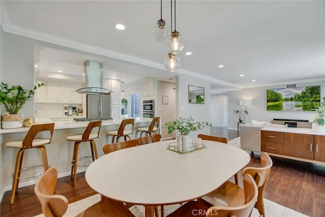 2486 Napoli Way, Costa Mesa, CA 92627 - dining space with dark wood finished floors, ornamental molding, and recessed lighting