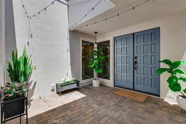 2486 Napoli Way, Costa Mesa, CA 92627 - property entrance with stucco siding and a patio area