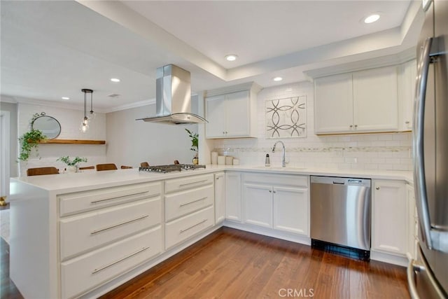 2486 Napoli Way, Costa Mesa, CA 92627 - kitchen with appliances with stainless steel finishes, wall chimney exhaust hood, a sink, a peninsula, and light countertops