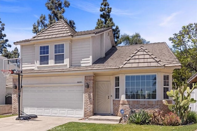 6600 Montresor Pl, Rancho Cucamonga, CA 91737 - view of front of property with brick siding, driveway, an attached garage, and a tiled roof