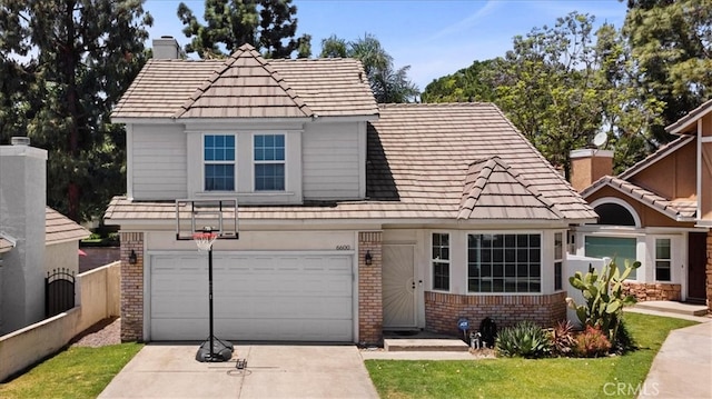 6600 Montresor Pl, Rancho Cucamonga, CA 91737 - traditional home with brick siding, driveway, a chimney, and an attached garage