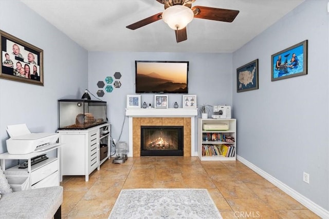 6600 Montresor Pl, Rancho Cucamonga, CA 91737 - living area with ceiling fan, a tile fireplace, baseboards, and light stone finish floors