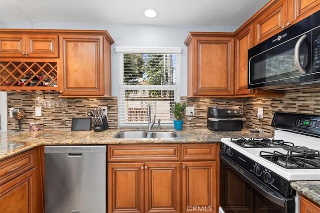 6600 Montresor Pl, Rancho Cucamonga, CA 91737 - kitchen featuring gas range, stainless steel dishwasher, black microwave, a sink, and brown cabinets