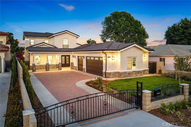 4840 Temple City Blvd, Temple City, CA 91780 - view of front of home featuring stone siding, stucco siding, a garage, and decorative driveway