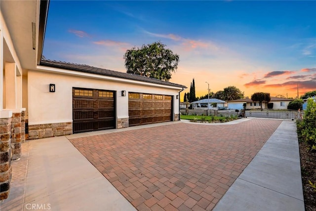 4840 Temple City Blvd, Temple City, CA 91780 - garage at dusk featuring decorative driveway